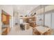 Spacious kitchen featuring an island with seating, tile floors, and wood cabinets at 14033 S 31St St, Phoenix, AZ 85048