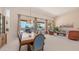 Open-concept living and dining area with large windows and views of the pool at 14033 S 31St St, Phoenix, AZ 85048