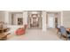 Open living room featuring tile floors, neutral colors, and a view into the foyer at 14033 S 31St St, Phoenix, AZ 85048