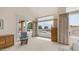 Bright living room with neutral carpet, multiple windows, and an outdoor patio view at 14033 S 31St St, Phoenix, AZ 85048