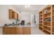 Functional home office with built-in shelving, a spacious desk, and ample storage at 14033 S 31St St, Phoenix, AZ 85048