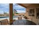 Relaxing covered patio seating area overlooking a sparkling private pool and desert landscaping at 14033 S 31St St, Phoenix, AZ 85048