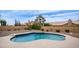 Inviting backyard pool with surrounding patio, desert landscaping, and mature trees for privacy at 14033 S 31St St, Phoenix, AZ 85048