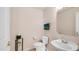 Convenient powder room featuring a pedestal sink, toilet, and tasteful decor at 14033 S 31St St, Phoenix, AZ 85048