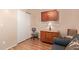 Cozy bedroom featuring wood-style floors and furniture, next to a sliding closet door at 150 N Nielson St, Gilbert, AZ 85234
