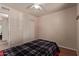 Bedroom featuring a bed, closet, and neutral-colored walls at 150 N Nielson St, Gilbert, AZ 85234