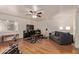 Large bonus area featuring hardwood floors, a ceiling fan, and space for various activities at 150 N Nielson St, Gilbert, AZ 85234