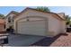 Spacious attached garage with a large driveway, perfect for multiple vehicles at 150 N Nielson St, Gilbert, AZ 85234