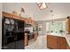 Bright kitchen featuring stainless steel appliances, white countertops, and tile flooring at 150 N Nielson St, Gilbert, AZ 85234