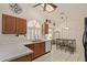 Bright kitchen featuring white countertops, tile flooring, and an arched window at 150 N Nielson St, Gilbert, AZ 85234