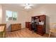 Bright home office with wood laminate flooring and a large window overlooking the garden at 150 N Nielson St, Gilbert, AZ 85234