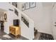 Inviting entryway with staircase, stylish decor, and a view into the modern kitchen at 15550 N Frank Lloyd Wright Blvd # 1101, Scottsdale, AZ 85260