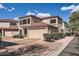 Charming two-story townhome with a two-car garage and beautiful desert landscaping at 15550 N Frank Lloyd Wright Blvd # 1101, Scottsdale, AZ 85260