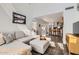 Bright living room with tall ceilings and hardwood floors that opens to the kitchen at 15550 N Frank Lloyd Wright Blvd # 1101, Scottsdale, AZ 85260