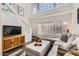 Bright living room with tall ceilings, hardwood floors, and natural light at 15550 N Frank Lloyd Wright Blvd # 1101, Scottsdale, AZ 85260