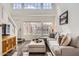 Bright living room with tall ceilings, hardwood floors, and an inviting atmosphere at 15550 N Frank Lloyd Wright Blvd # 1101, Scottsdale, AZ 85260