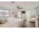 Serene bedroom showcasing a queen bed, modern decor, and a glimpse into the ensuite bathroom at 15550 N Frank Lloyd Wright Blvd # 1101, Scottsdale, AZ 85260