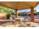 Outdoor patio with table and chairs, perfect for relaxing by the community pool at 15550 N Frank Lloyd Wright Blvd # 1101, Scottsdale, AZ 85260