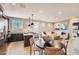 Bright living space features an open concept kitchen, dining area, and adjacent living room at 15791 W Kendall St, Goodyear, AZ 85338