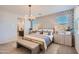 Inviting main bedroom with a plush bed, matching nightstands, and a cozy rug at 15791 W Kendall St, Goodyear, AZ 85338
