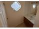 Bright bathroom with a modern sink and unique, decorative window providing natural light at 16602 N 25Th St # 217, Phoenix, AZ 85032