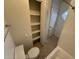 Well-lit bathroom featuring a convenient storage area, toilet and tub-shower combination at 16602 N 25Th St # 217, Phoenix, AZ 85032
