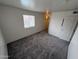 Inviting bedroom with soft carpeting, bright window, and convenient access to the hallway and closet at 16602 N 25Th St # 217, Phoenix, AZ 85032