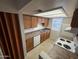 Efficient kitchen layout with ample storage, basic appliances, and practical countertop space at 16602 N 25Th St # 217, Phoenix, AZ 85032