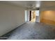 Comfortable living area showcasing modern carpeting and an open layout connecting to other living spaces at 16602 N 25Th St # 217, Phoenix, AZ 85032