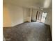 Cozy living room with neutral walls, ceiling fan, and patio access for indoor/outdoor enjoyment at 16602 N 25Th St # 217, Phoenix, AZ 85032