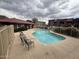 Community pool with surrounding buildings and seating at 16602 N 25Th St # 217, Phoenix, AZ 85032