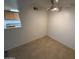 Neutral room with ceramic tile flooring and ceiling fan at 16602 N 25Th St # 217, Phoenix, AZ 85032