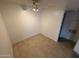 A view of a neutral room with ceramic tile flooring and ceiling fan at 16602 N 25Th St # 217, Phoenix, AZ 85032