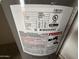 Water heater label with model number, date, wattage, and certifications at 16602 N 25Th St # 217, Phoenix, AZ 85032