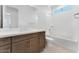 Bathroom featuring dual vanity with modern fixtures and a bathtub at 18883 E Celtic Manor Dr, Queen Creek, AZ 85142