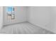 Neutral bedroom with carpet and large windows at 18883 E Celtic Manor Dr, Queen Creek, AZ 85142