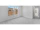 Bedroom with carpet and large windows bringing in lots of natural light at 18883 E Celtic Manor Dr, Queen Creek, AZ 85142
