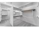 Spacious walk-in closet featuring ample shelving and hanging space for optimal organization at 18883 E Celtic Manor Dr, Queen Creek, AZ 85142