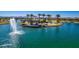 Scenic lake within the community featuring a fountain and a lakeside platform for recreation and relaxation at 18883 E Celtic Manor Dr, Queen Creek, AZ 85142