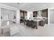 Open kitchen boasts a spacious island with bar seating and stainless steel appliances at 18883 E Celtic Manor Dr, Queen Creek, AZ 85142