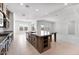 Open-concept kitchen featuring a center island with granite countertops and stainless steel appliances at 18883 E Celtic Manor Dr, Queen Creek, AZ 85142
