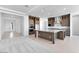 A spacious kitchen boasts stainless steel appliances, granite countertops, and ample cabinet space at 18883 E Celtic Manor Dr, Queen Creek, AZ 85142