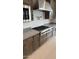 Gourmet kitchen featuring stainless steel appliances, granite countertops, and ample cabinet space at 18883 E Celtic Manor Dr, Queen Creek, AZ 85142
