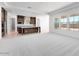 Open-concept living room and kitchen with modern cabinets and flooring, and stainless steel appliances at 18883 E Celtic Manor Dr, Queen Creek, AZ 85142