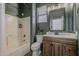 Bathroom featuring a shower-tub combo, modern fixtures, and vanity at 19323 E Canary Way, Queen Creek, AZ 85142