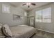 Bedroom with ceiling fan and natural light at 19323 E Canary Way, Queen Creek, AZ 85142