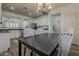 Dining area that opens to the kitchen with updated appliances and countertops at 19323 E Canary Way, Queen Creek, AZ 85142