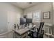 Office features a modern desk, dual monitors, and a printer at 19323 E Canary Way, Queen Creek, AZ 85142