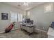 Office space includes a ceiling fan, natural light, and golf clubs at 19323 E Canary Way, Queen Creek, AZ 85142