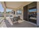 Covered patio with seating area and view of the pool, perfect for outdoor relaxation and entertaining at 19323 E Canary Way, Queen Creek, AZ 85142